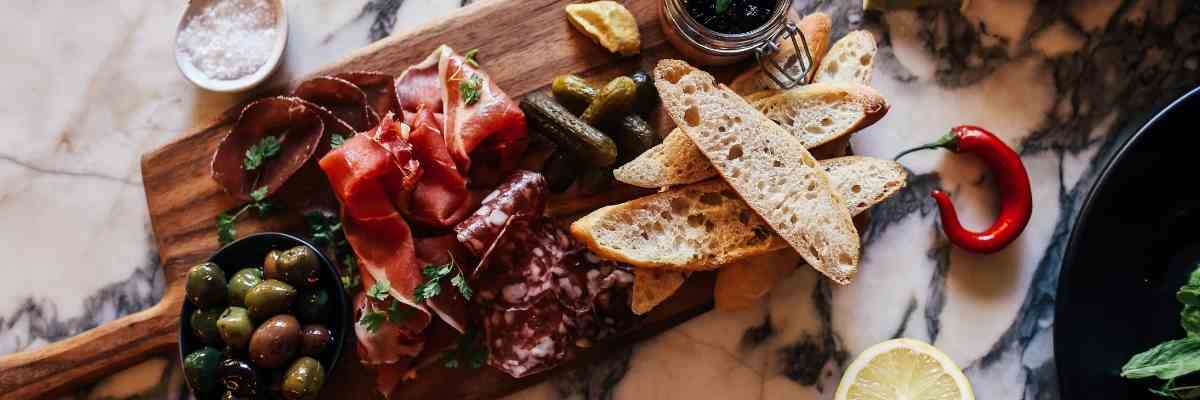 Mediterranean foods on a chopping board. 